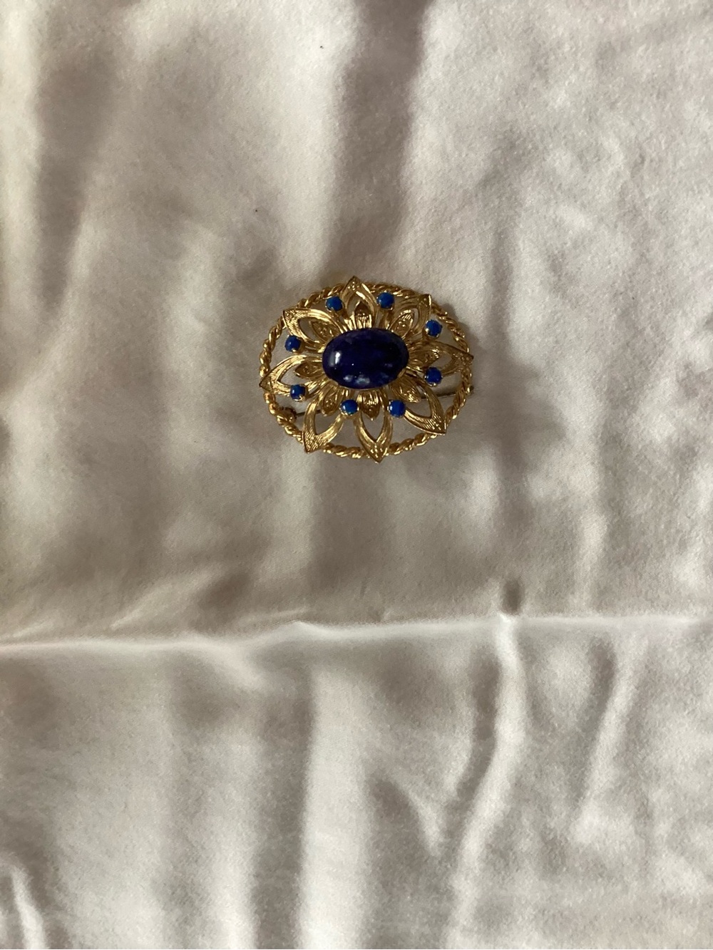 Gold-Tone Brooch with Deep Blue Cabochon Accents